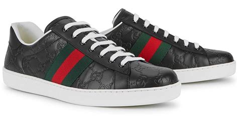 gucci embossed leather sneakers